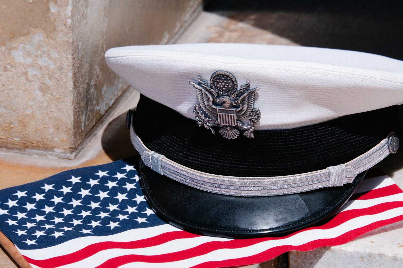 a hat sitting on top of an american flag